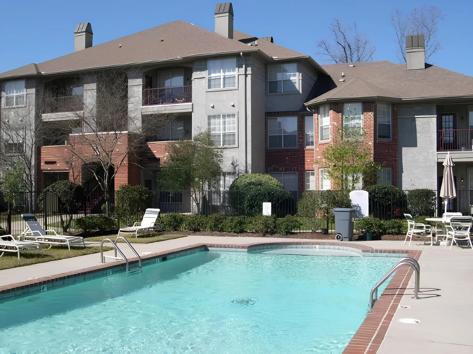 Pool and residences at Park on Bluebonnet Apartments